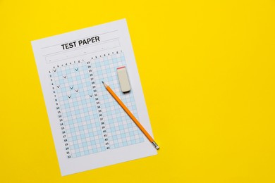 Photo of Student passing exam. Answer sheet, pencil and eraser on yellow background, flat lay. Space for text
