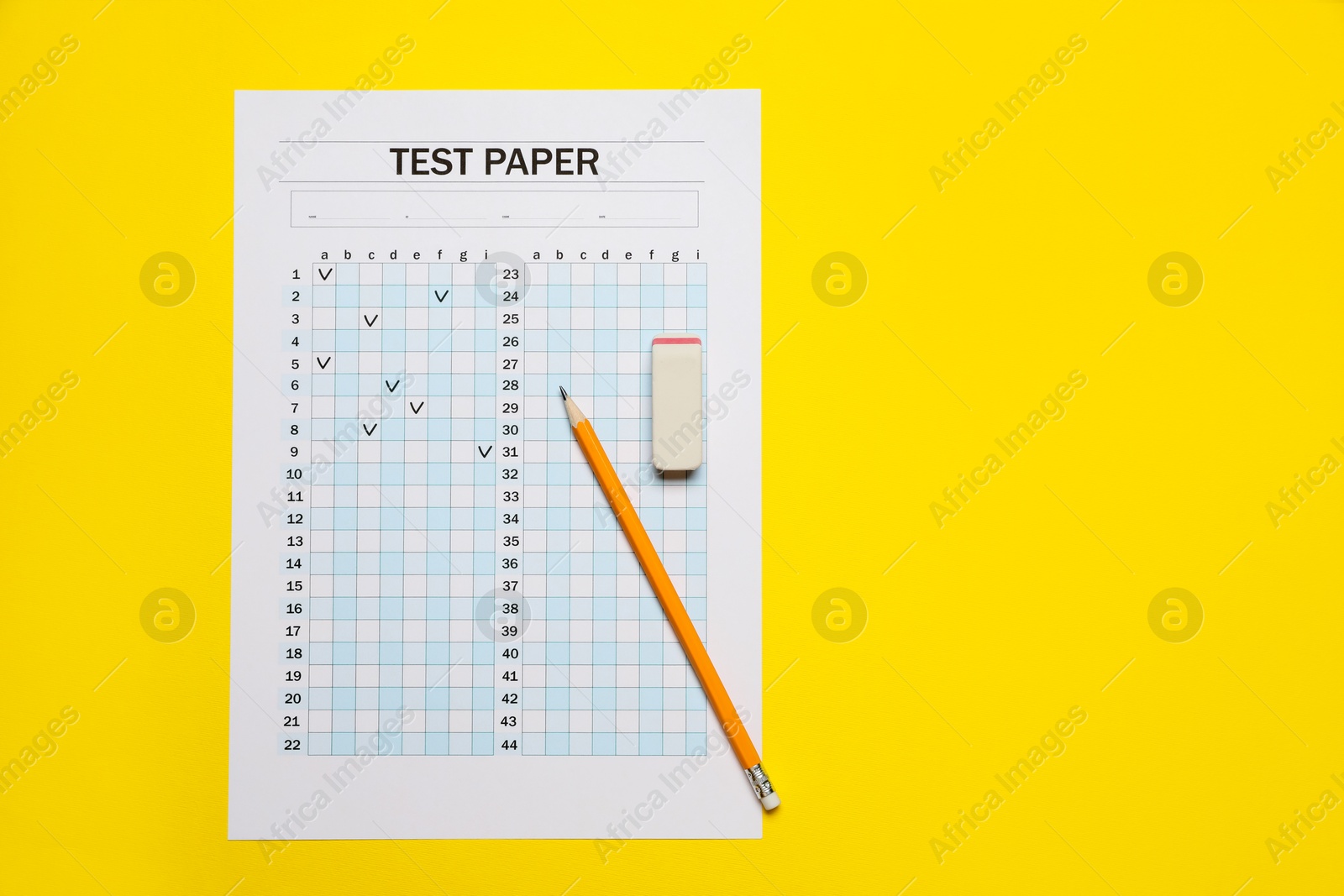 Photo of Student passing exam. Answer sheet, pencil and eraser on yellow background, flat lay. Space for text