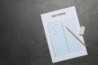 Photo of Student passing exam. Answer sheet, pencil and eraser on gray textured table, flat lay. Space for text