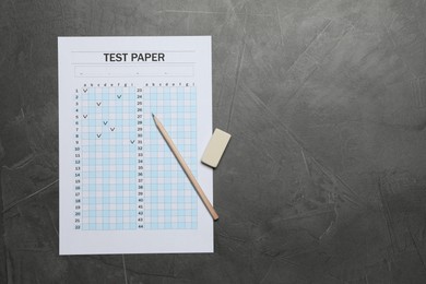 Photo of Student passing exam. Answer sheet, pencil and eraser on gray textured table, flat lay. Space for text