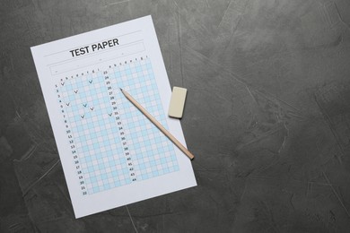 Photo of Student passing exam. Answer sheet, pencil and eraser on gray textured table, flat lay. Space for text