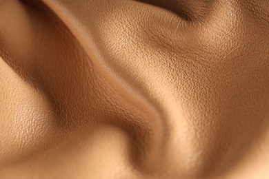 Photo of Texture of natural leather as background, top view