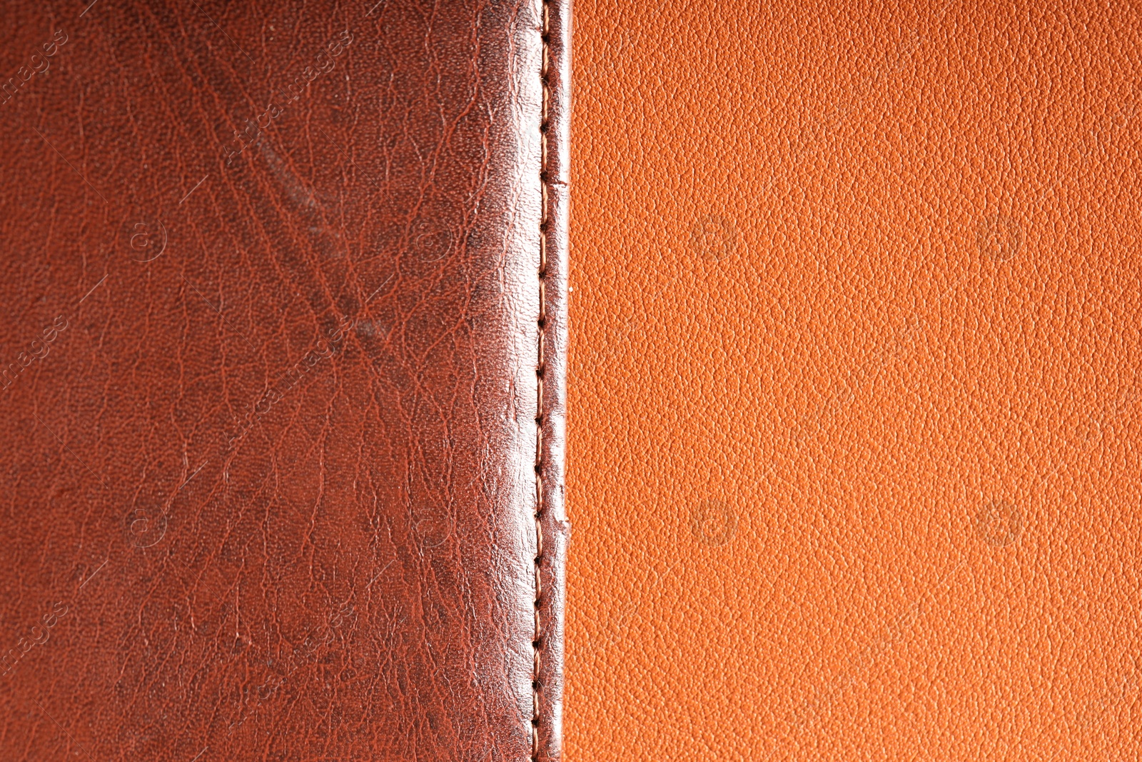 Brown natural leather with seam on color surface, top view Photo of Brown natural leather with seam on color surface, top view