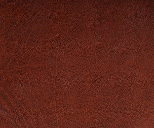 Photo of Texture of natural leather as background, top view