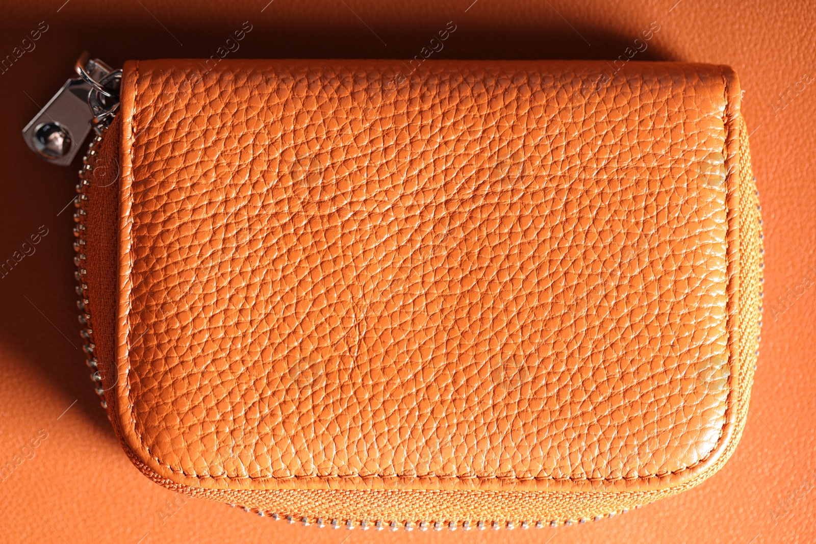 Leather bag on color surface, top view Photo of Leather bag on color surface, top view