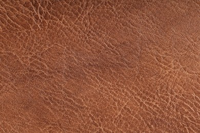 Photo of Texture of natural leather as background, top view