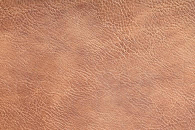 Photo of Texture of natural leather as background, top view