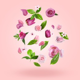 Image of Beautiful flowers, petals and green leaves in air against pink gradient background