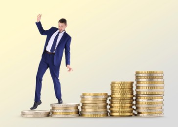 Image of Businessman walking on coins. Stacks from smaller to bigger against beige gradient background. Path to wealth
