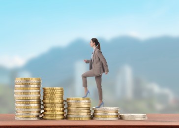 Image of Business woman walking up coins against cityscape. Stacks from smaller to bigger. Path to wealth