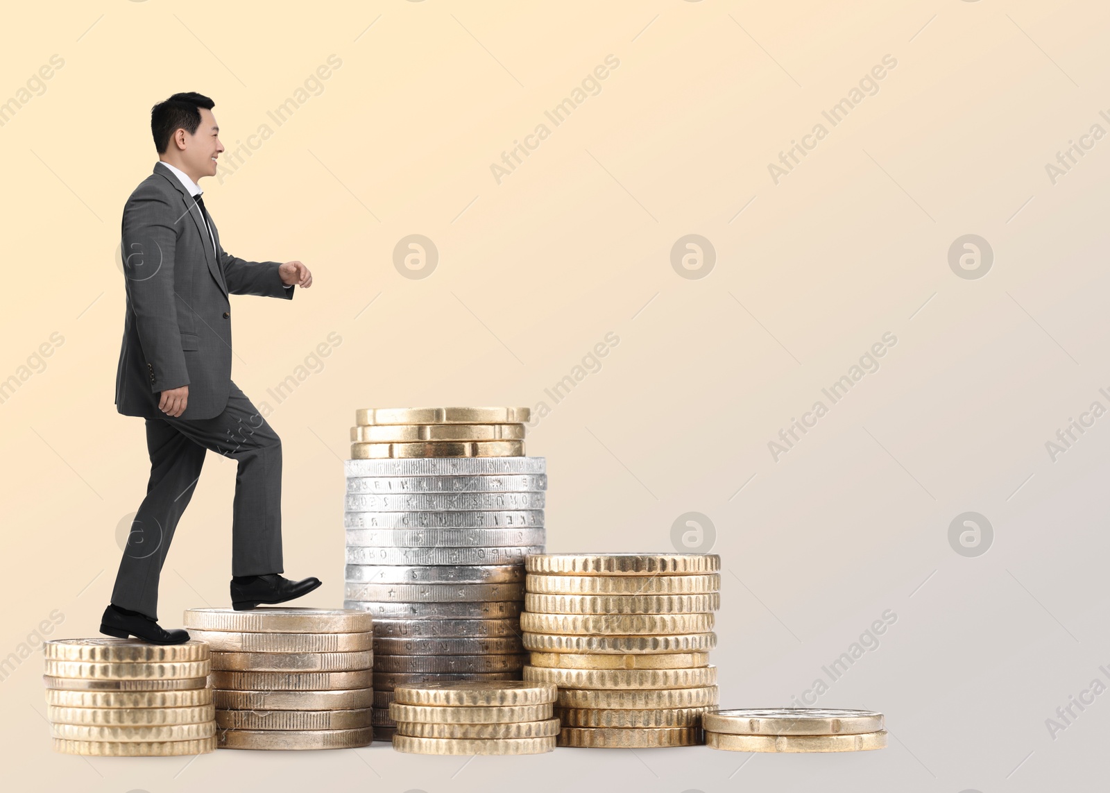 Businessman walking up stacked coins against beige gradient background. Path to wealth Image of Businessman walking up stacked coins against beige gradient background. Path to wealth