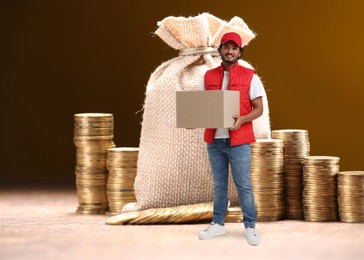 Image of Delivery man with cardboard box near coins on table against brown background. Earnings concept