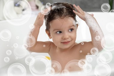 Image of Cute little girl washing hair with shampoo while taking bath. Soap bubbles in air