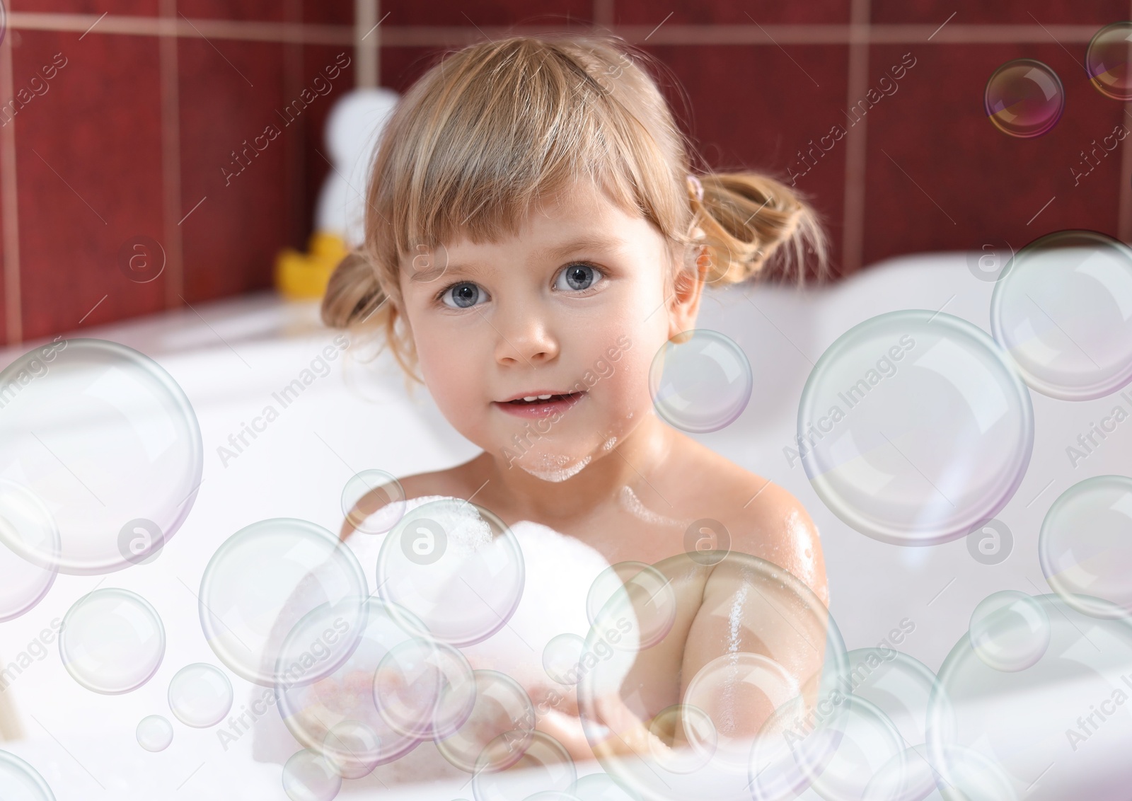 Cute little girl taking bath at home. Soap bubbles in air Image of Cute little girl taking bath at home. Soap bubbles in air