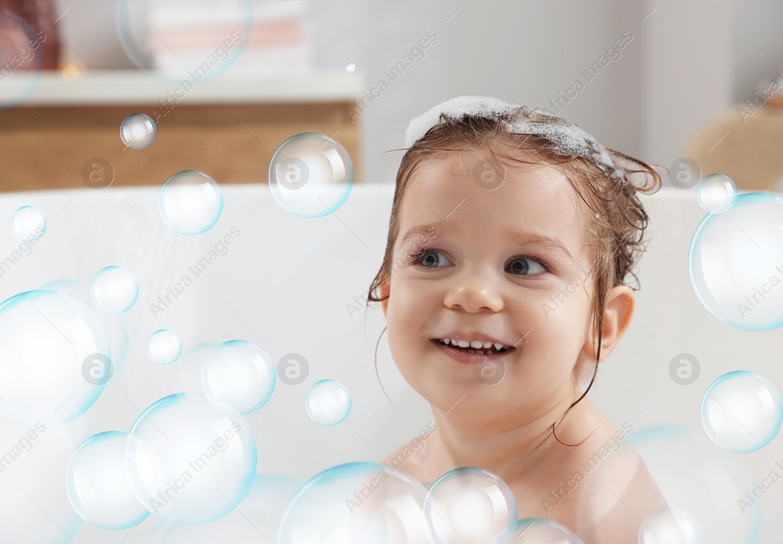 Cute little baby taking bath at home. Soap bubbles in air Image of Cute little baby taking bath at home. Soap bubbles in air