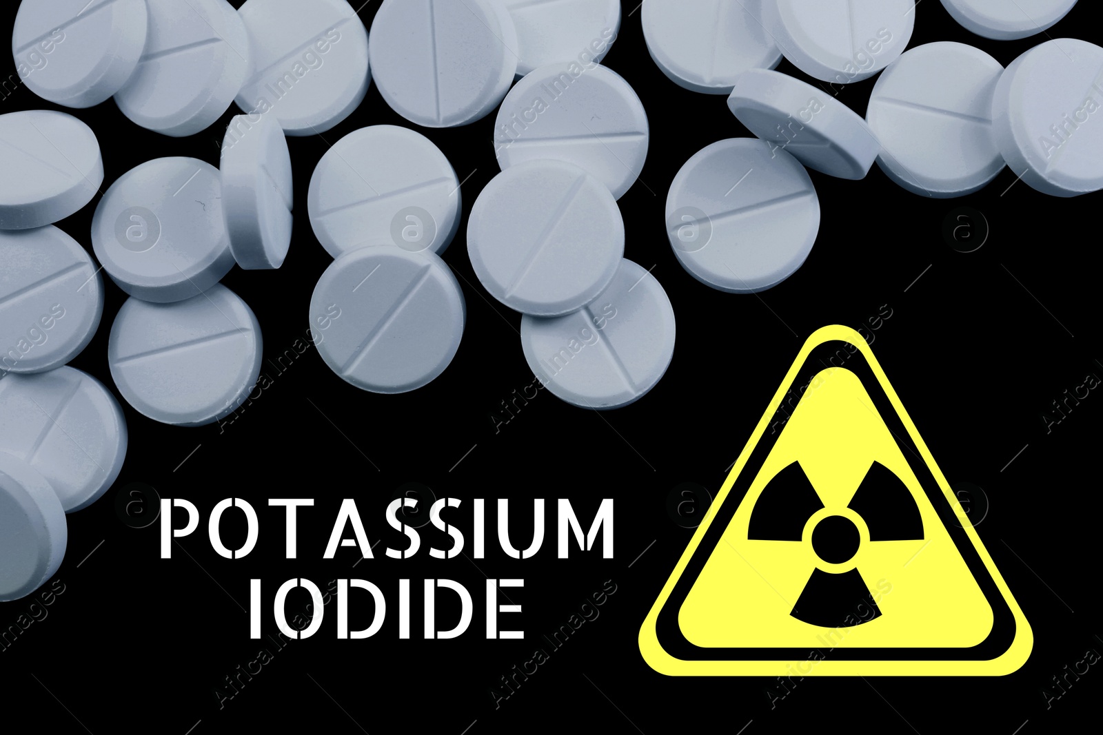 Potassium iodide pills and warning sign on black background. Iodine consumption during radioactive contamination Image of Potassium iodide pills and warning sign on black background. Iodine consumption during radioactive contamination