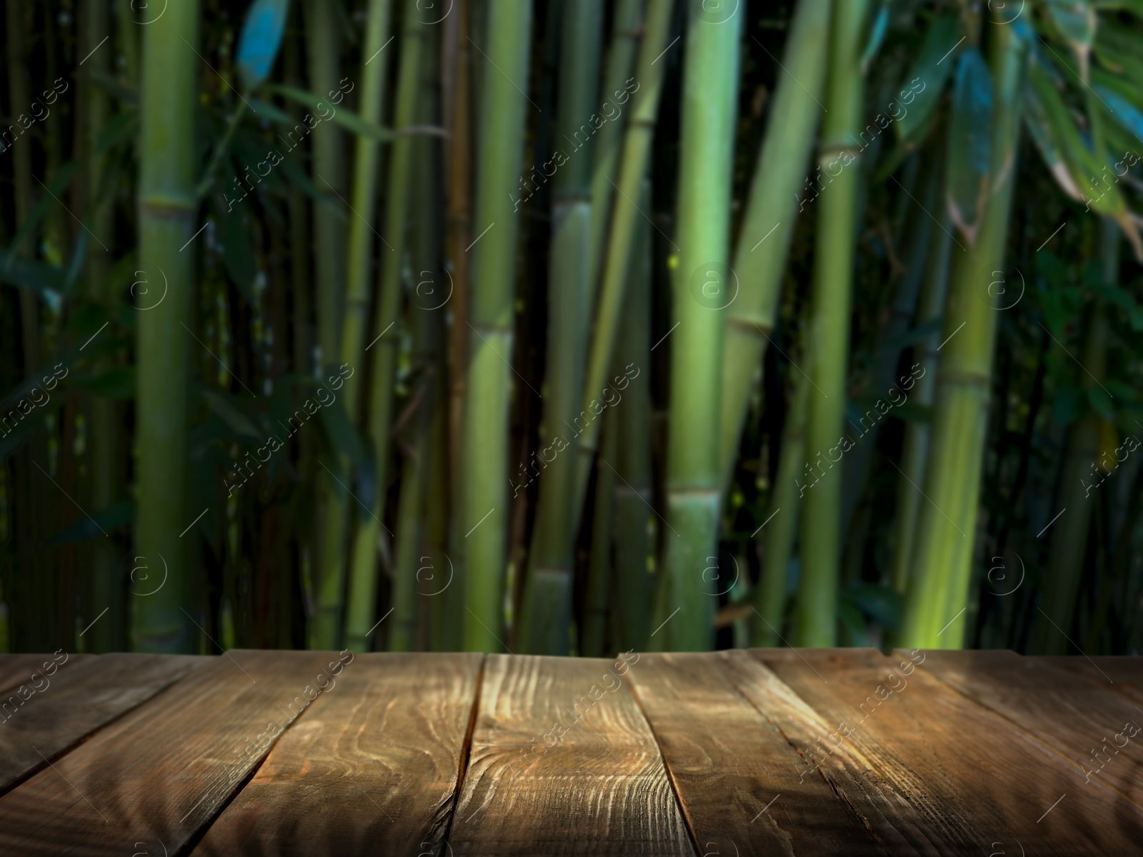 Wooden table in jungle. Empty surface against bamboo stalks. Poster with space for design Image of Wooden table in jungle. Empty surface against bamboo stalks. Poster with space for design