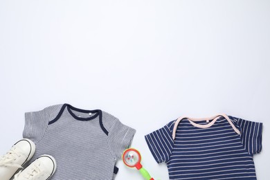 Photo of Stylish baby clothes, shoes and accessory on white background, flat lay. Space for text