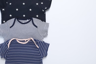 Photo of Stylish baby clothes on white background, flat lay. Space for text