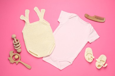 Photo of Stylish baby clothes and accessories on pink background, flat lay