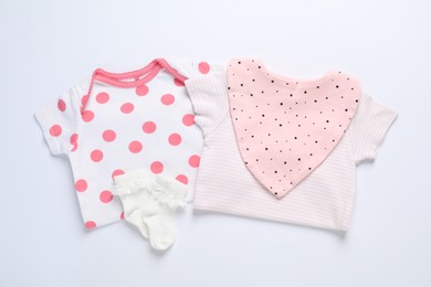 Photo of Stylish baby clothes and accessories on white background, flat lay