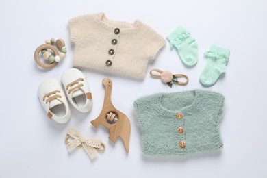 Photo of Stylish baby clothes and accessories on white background, flat lay