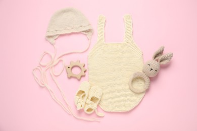 Photo of Stylish baby clothes and accessories on pink background, flat lay