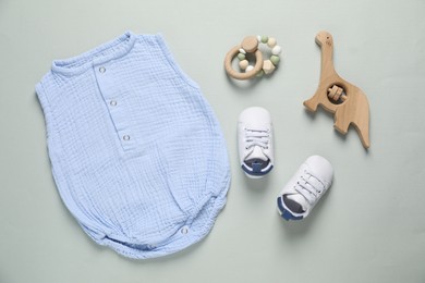 Photo of Stylish baby clothes and accessories on grey background, flat lay