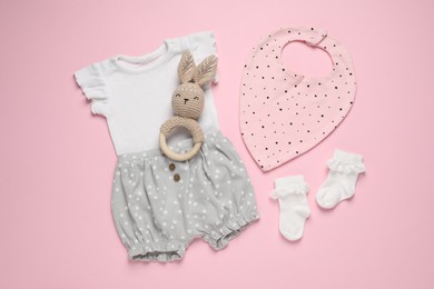 Photo of Stylish baby clothes and accessories on pink background, flat lay
