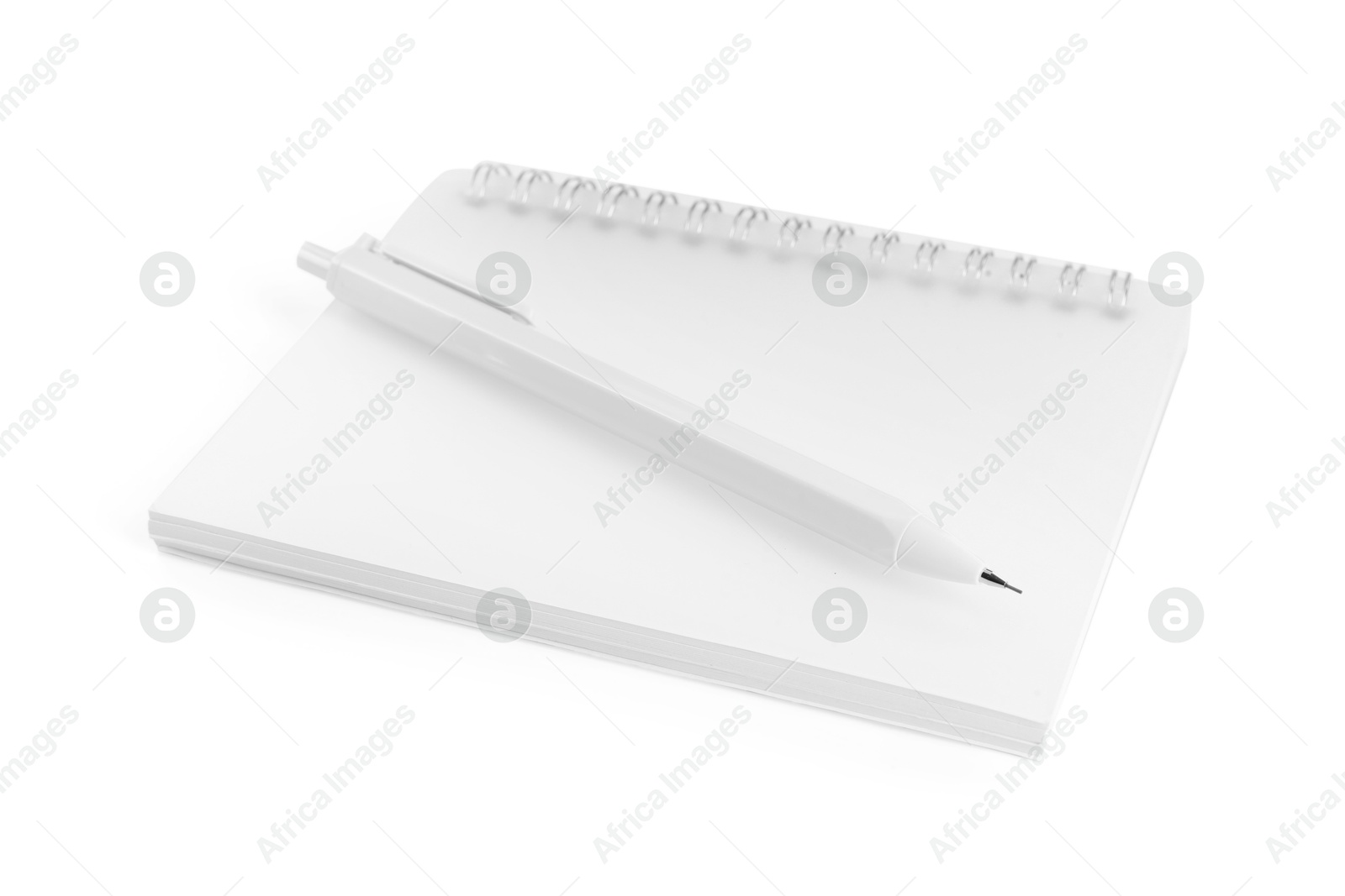 Notebook and mechanical pencil isolated on white Photo of Notebook and mechanical pencil isolated on white