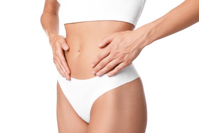 Photo of Woman with flat belly on white background, closeup