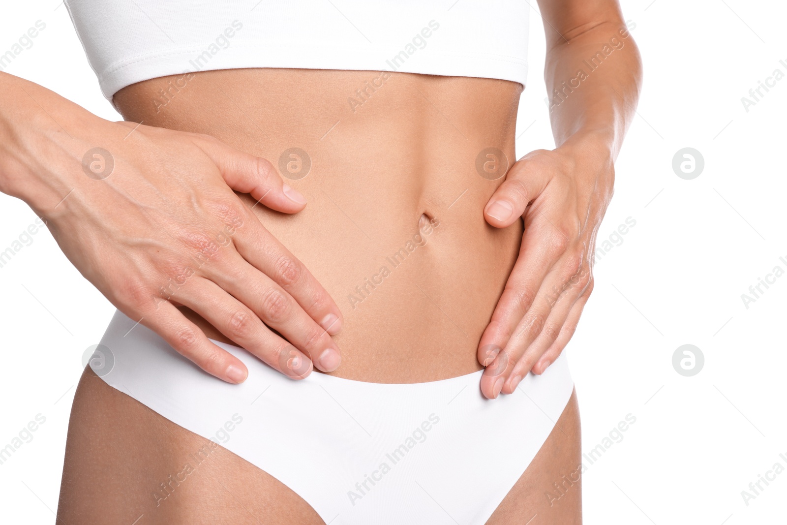 Woman with flat belly on white background, closeup Photo of Woman with flat belly on white background, closeup