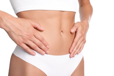 Photo of Woman with flat belly on white background, closeup
