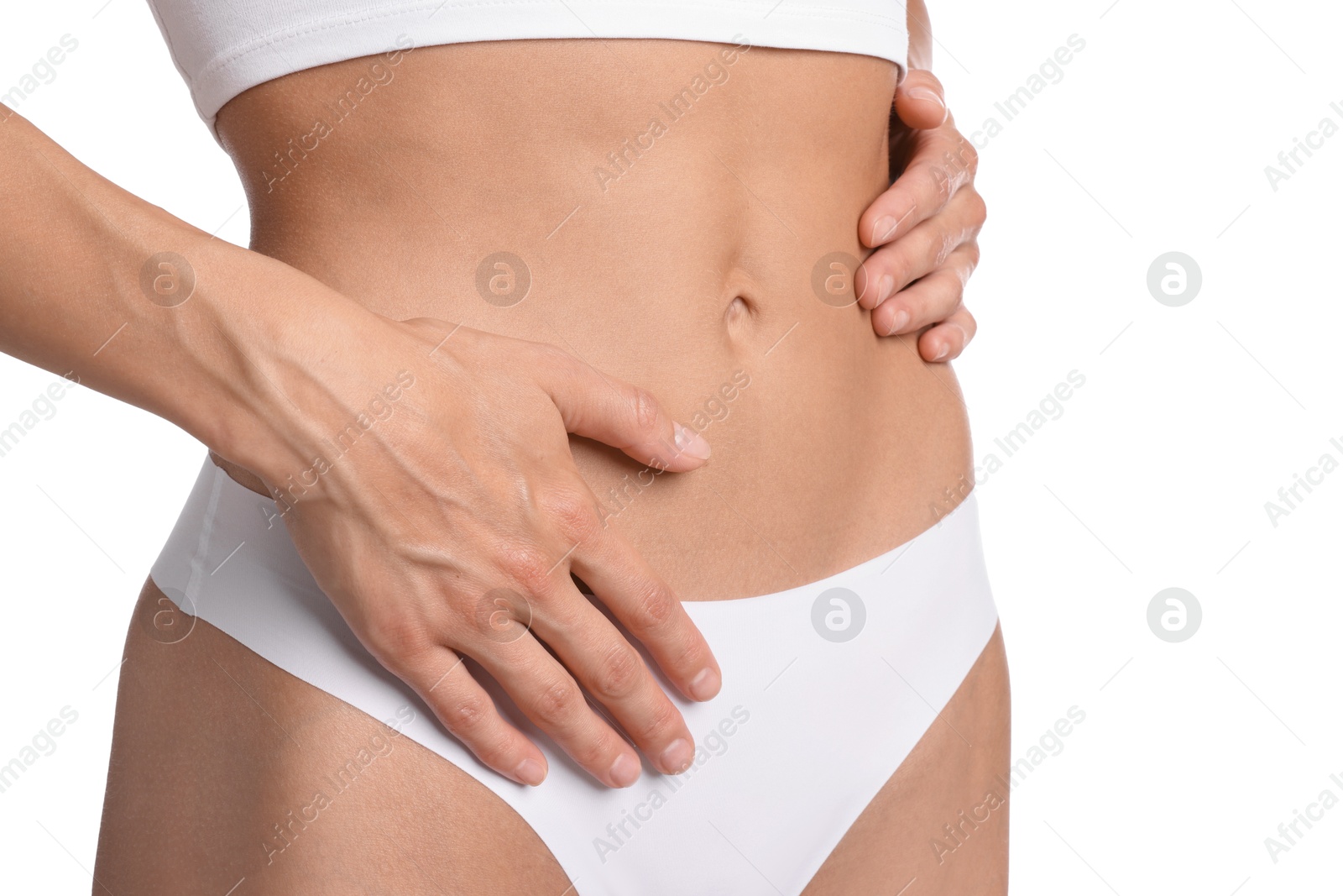Woman with flat belly on white background, closeup Photo of Woman with flat belly on white background, closeup