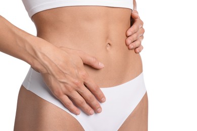 Photo of Woman with flat belly on white background, closeup