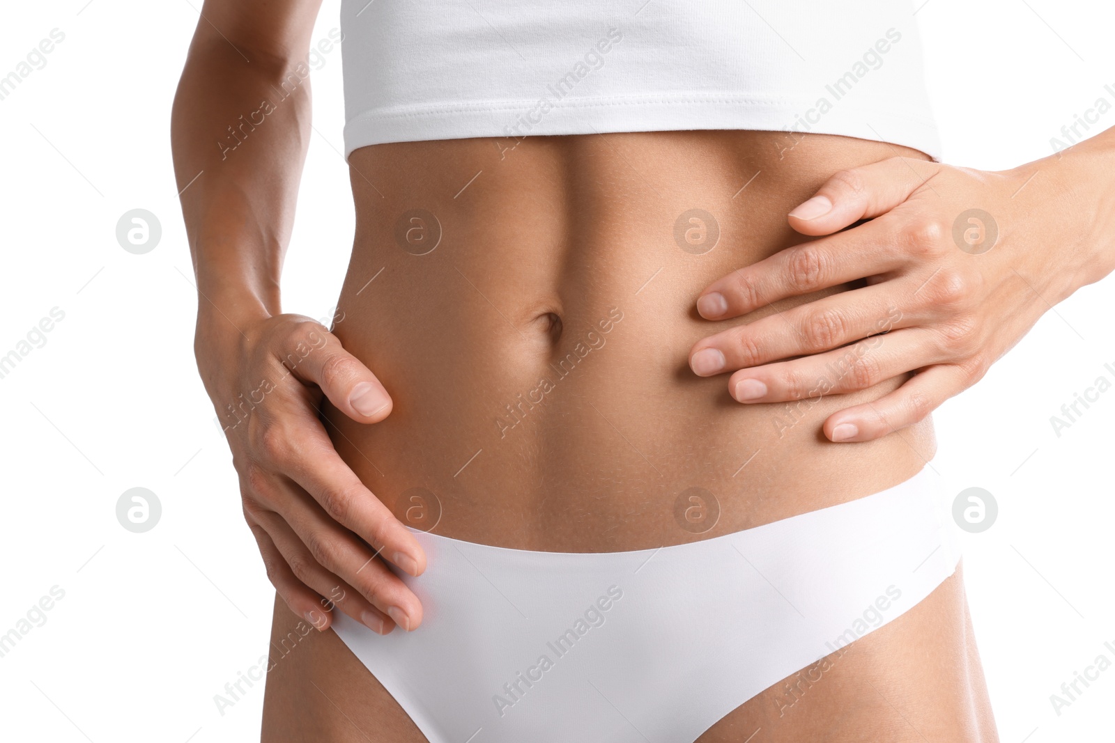 Woman with flat belly on white background, closeup Photo of Woman with flat belly on white background, closeup