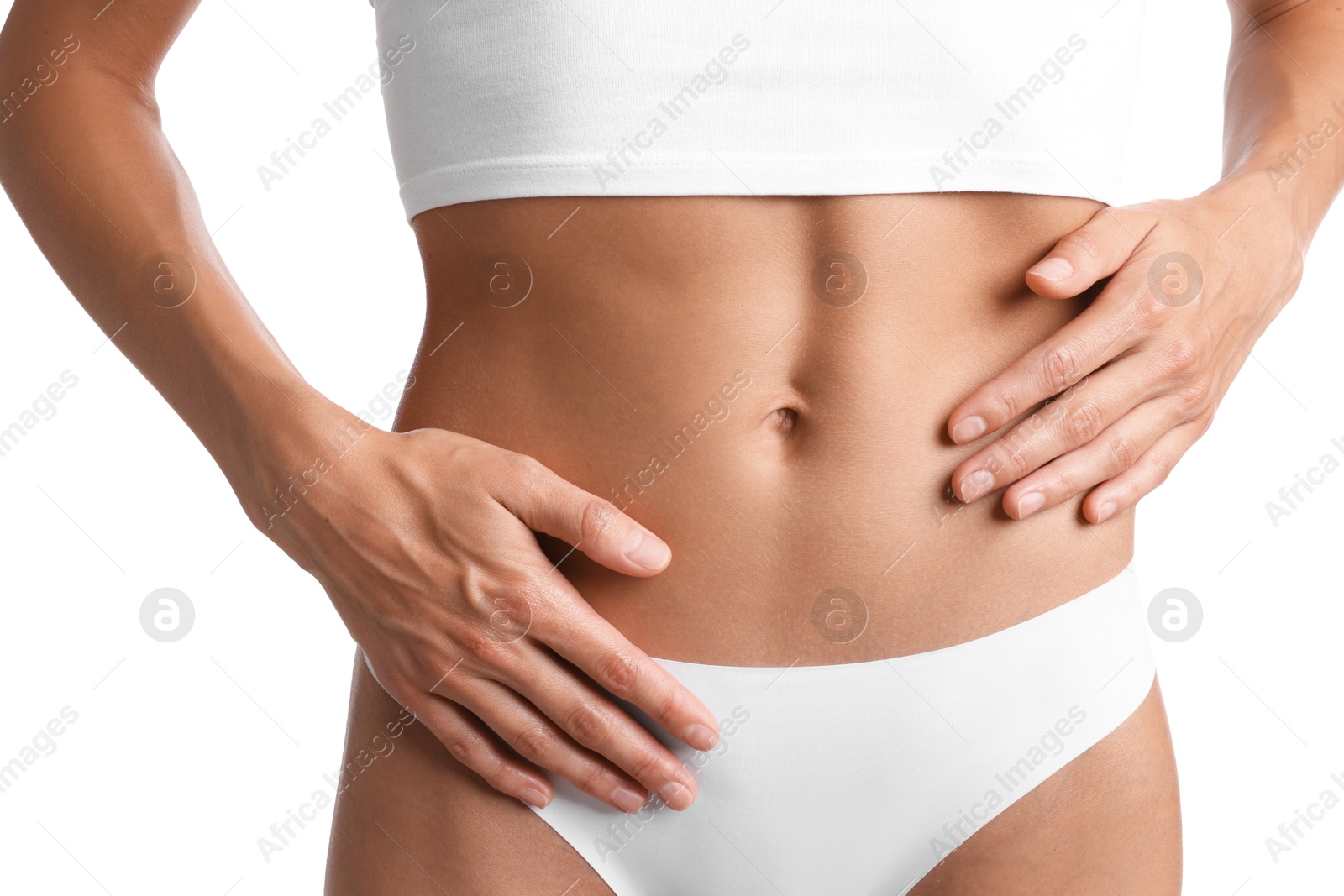 Woman with flat belly on white background, closeup Photo of Woman with flat belly on white background, closeup