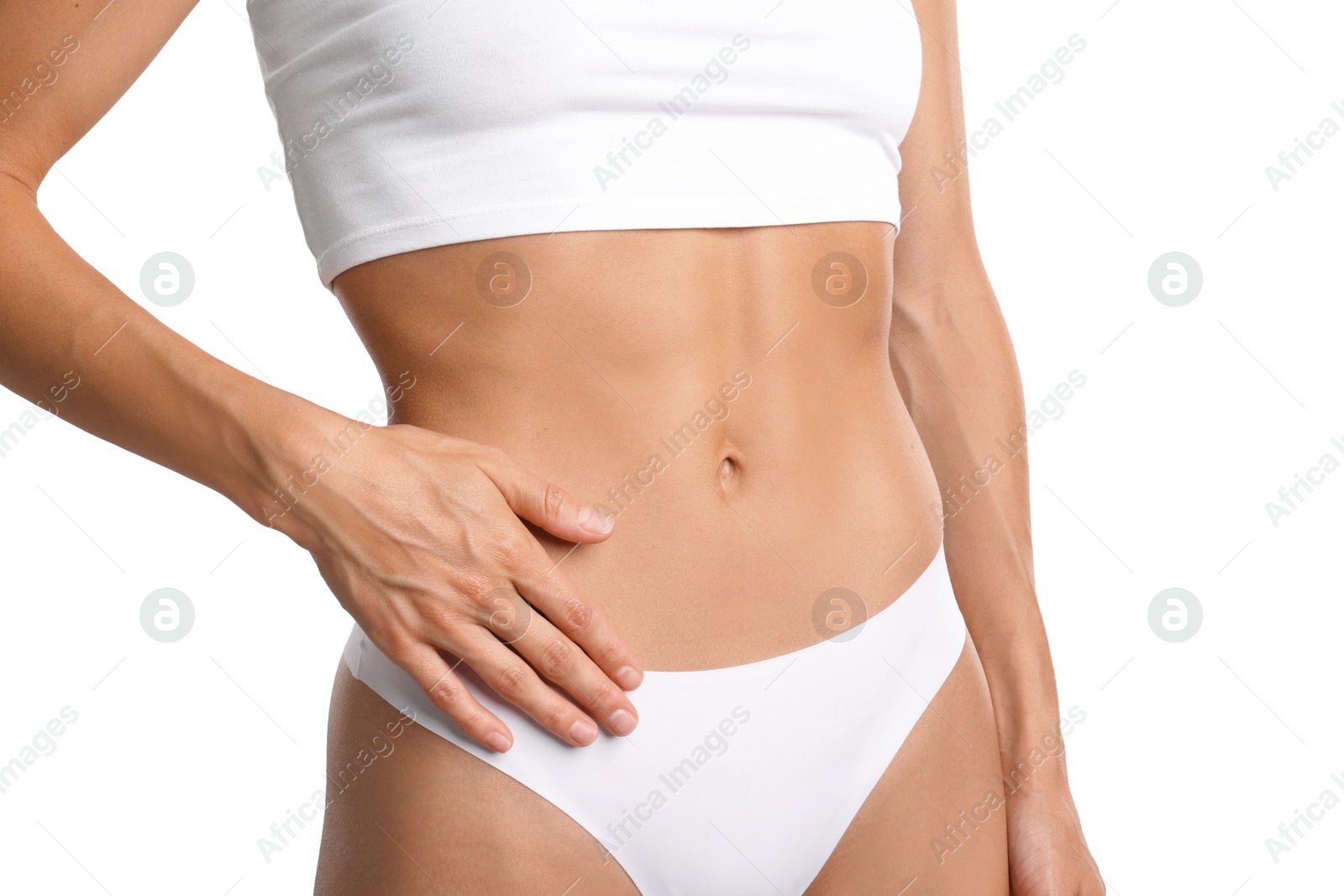 Woman with flat belly on white background, closeup Photo of Woman with flat belly on white background, closeup
