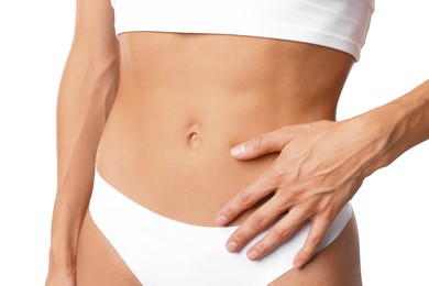 Photo of Woman with flat belly on white background, closeup