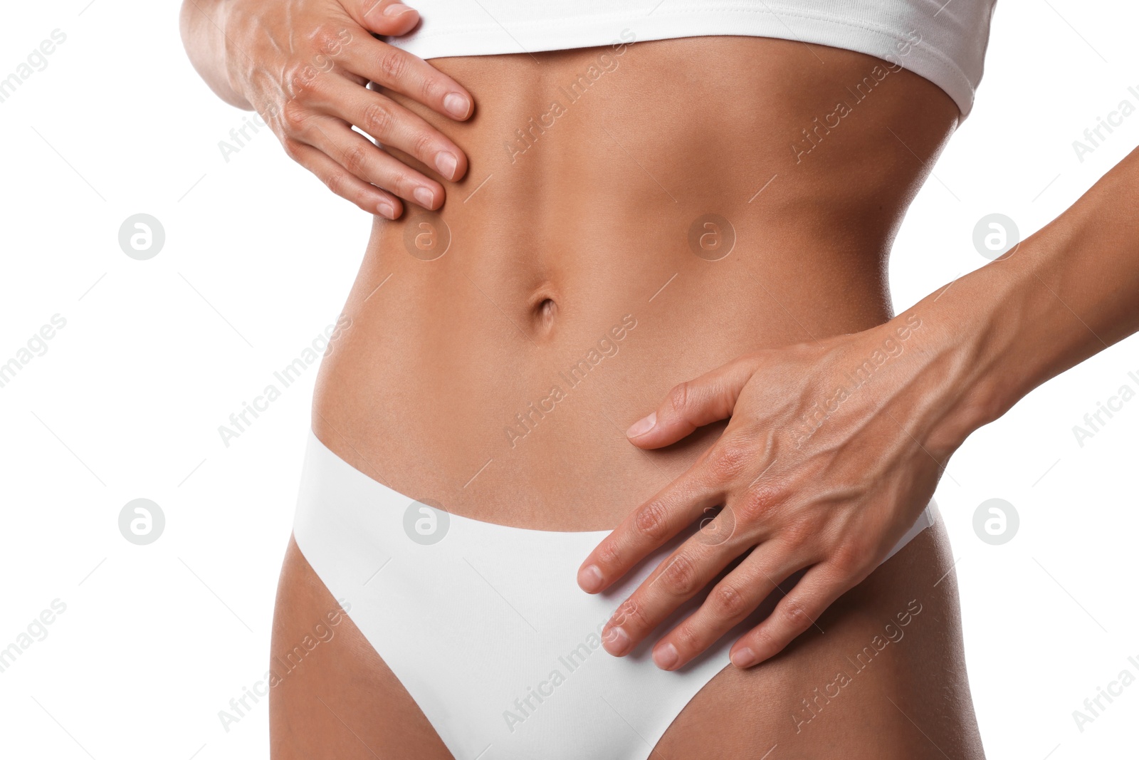 Woman with flat belly on white background, closeup Photo of Woman with flat belly on white background, closeup