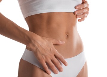 Photo of Woman with flat belly on white background, closeup