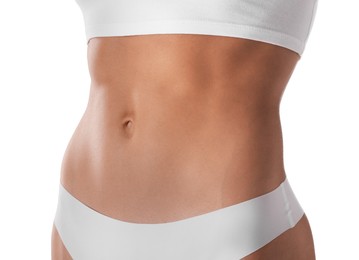 Photo of Woman with flat belly on white background, closeup