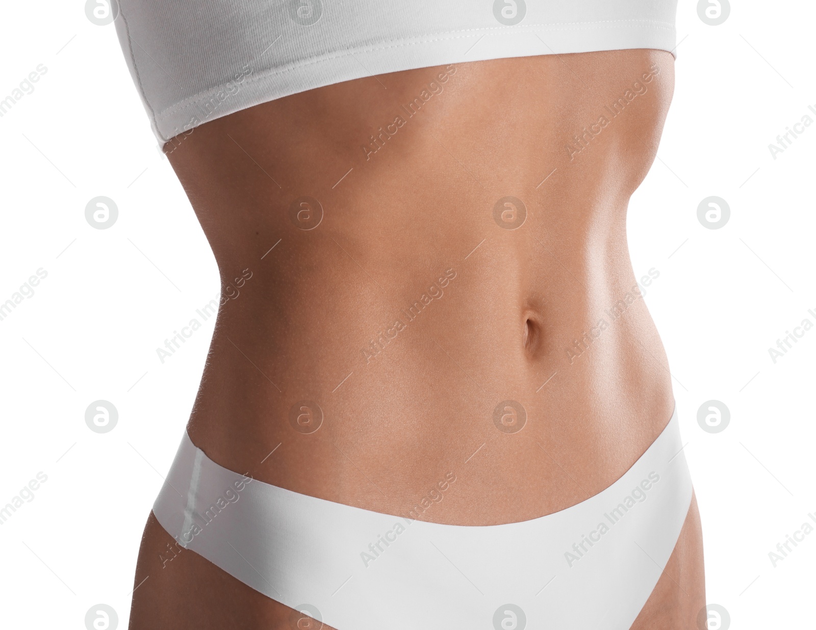Woman with flat belly on white background, closeup Photo of Woman with flat belly on white background, closeup
