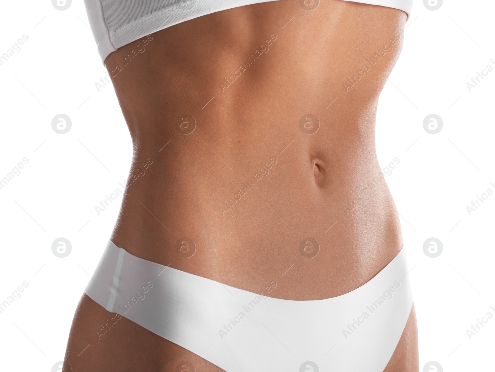 Woman with flat belly on white background, closeup Photo of Woman with flat belly on white background, closeup