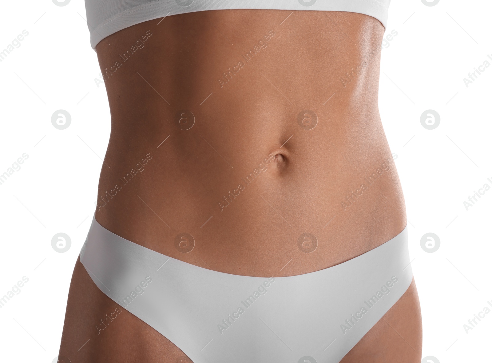 Woman with flat belly on white background, closeup Photo of Woman with flat belly on white background, closeup