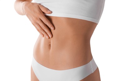 Photo of Woman with flat belly on white background, closeup