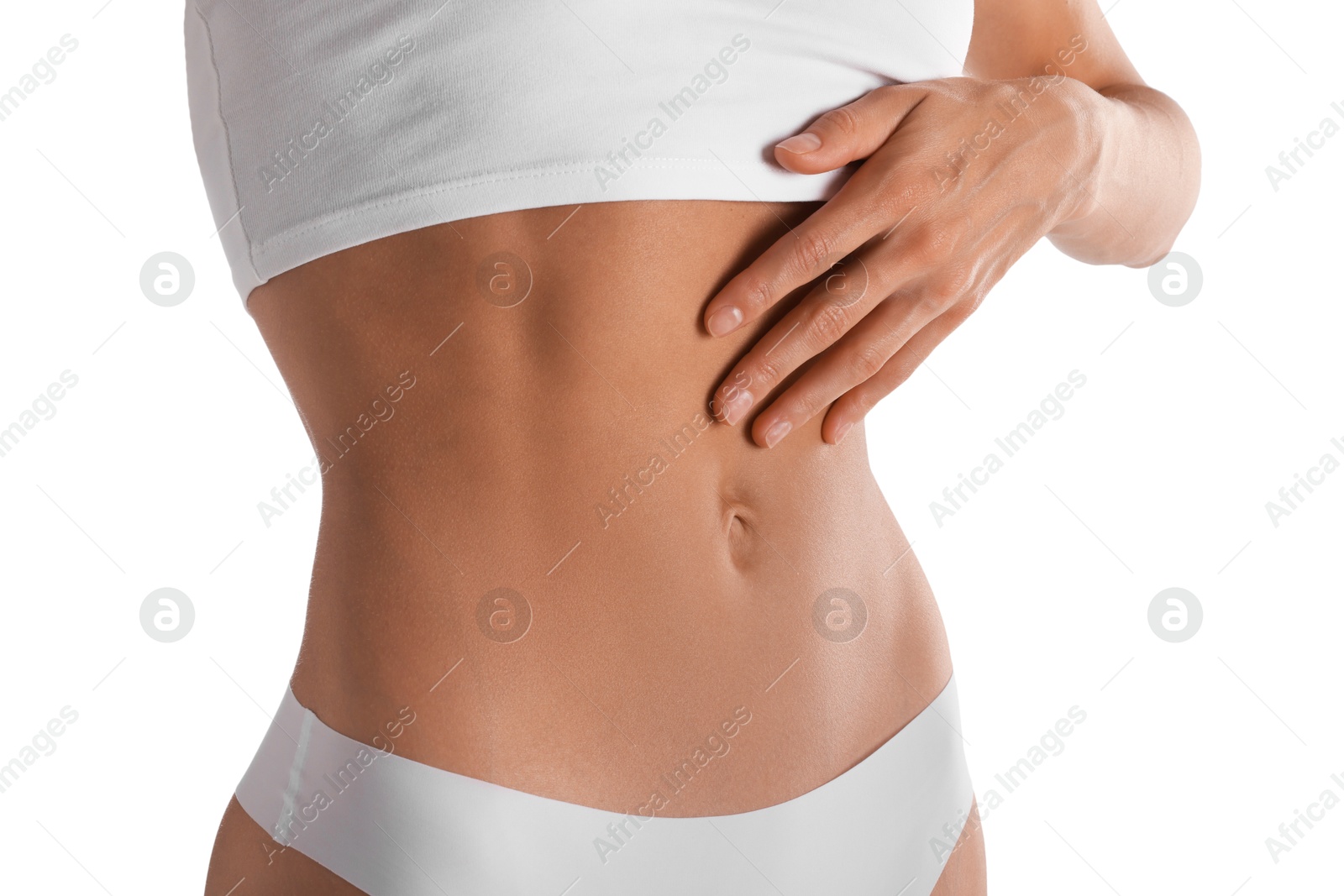 Woman with flat belly on white background, closeup Photo of Woman with flat belly on white background, closeup
