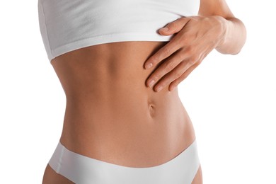 Photo of Woman with flat belly on white background, closeup