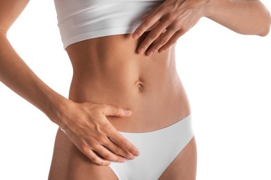 Photo of Woman with flat belly on white background, closeup