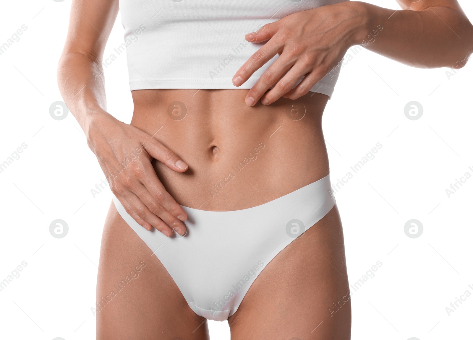 Woman with flat belly on white background, closeup Photo of Woman with flat belly on white background, closeup